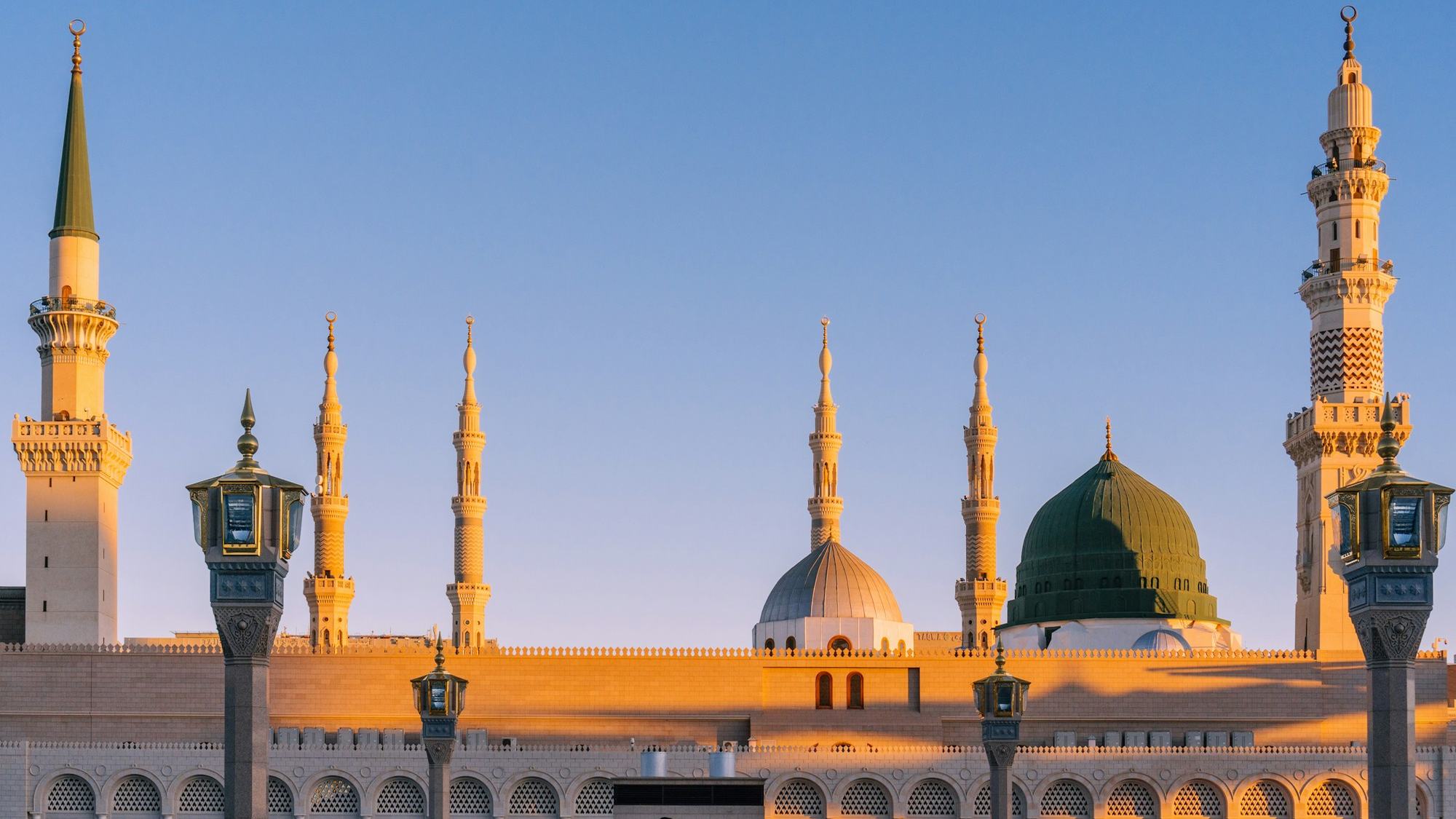 Al-Masjid an-Nabawi in Madinah under warm low sun
